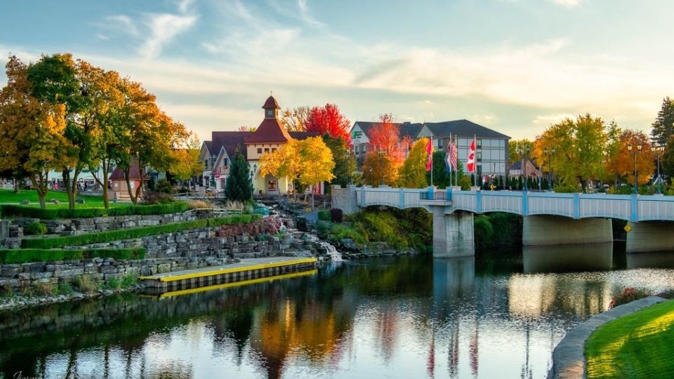 View of Frankenmuth River Place Shops from the Cass River on a perfect fall day