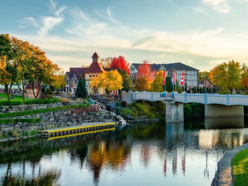 View of Frankenmuth River Place Shops from the Cass River on a perfect fall day