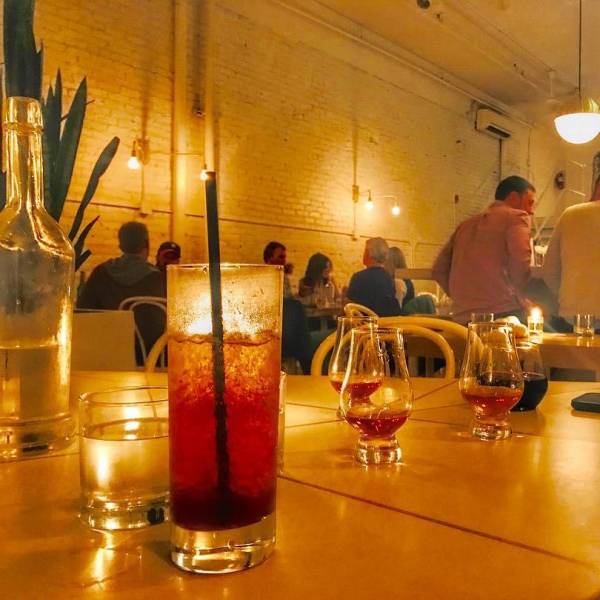 Cocktails on a table in the dimly-lit ambiance of the The Public House in Bay City