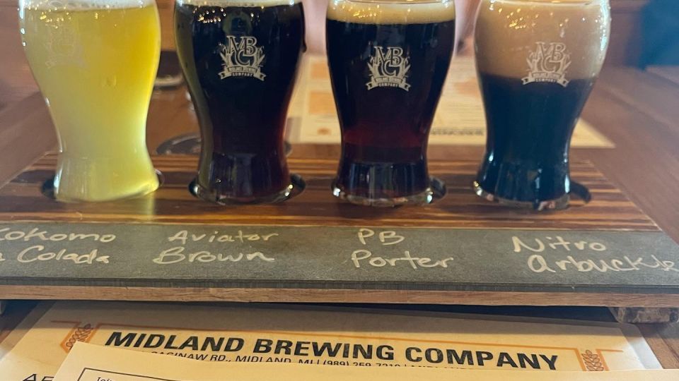 Patrons enjoying a Beer Flight Board at Midland Brewing Company in Midland
