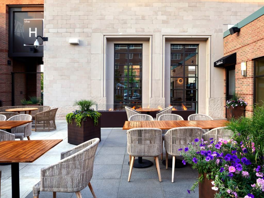 Gorgeous, summery views of the outdoor courtyard dining area of Cafe Zinc and ONe Eighteen at The H Hotel in Downtown Midland