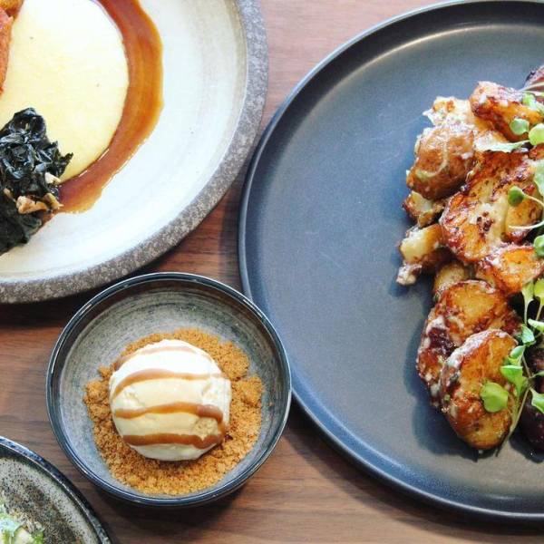 A spread of beautifully plated dishes at farm-to-table Aster in Midland