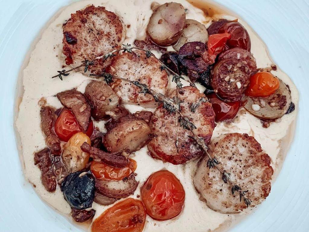 Pan-roasted scallops with brussels sprouts, crab risotto, and parmesan at Cafe Zinc in Midland