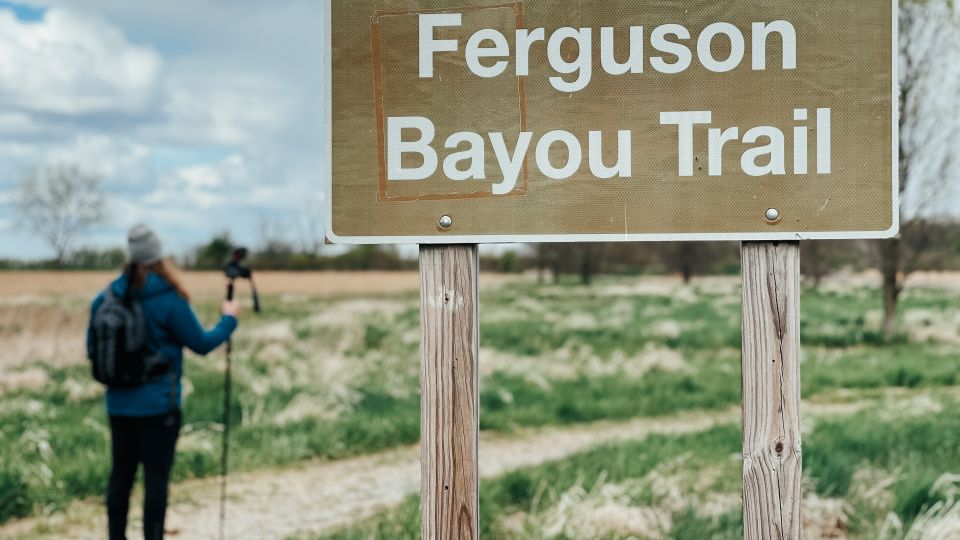 Guy walking on the Ferguson Bayou Trail at Shiawassee National Wildlife Refuge in Saginaw