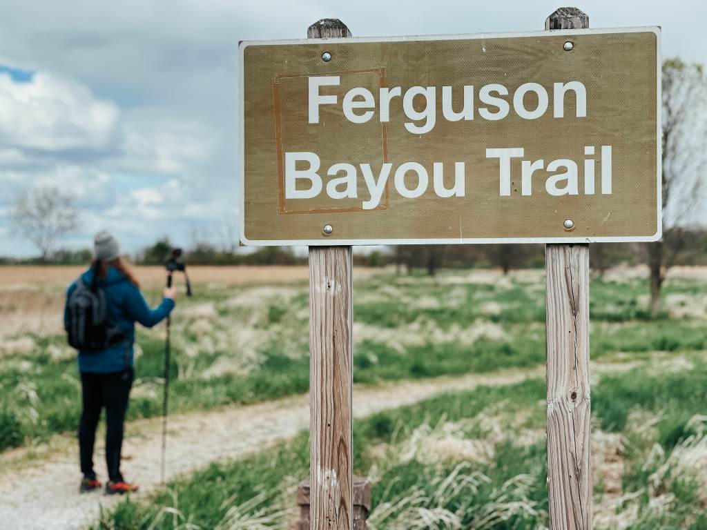Guy walking on the Ferguson Bayou Trail at Shiawassee National Wildlife Refuge in Saginaw