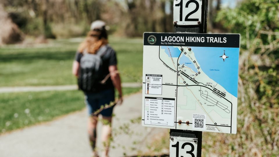 Guy walking the Lagoon Hiking Trails of Tobico Marsh at Bay City State Park in Bay City