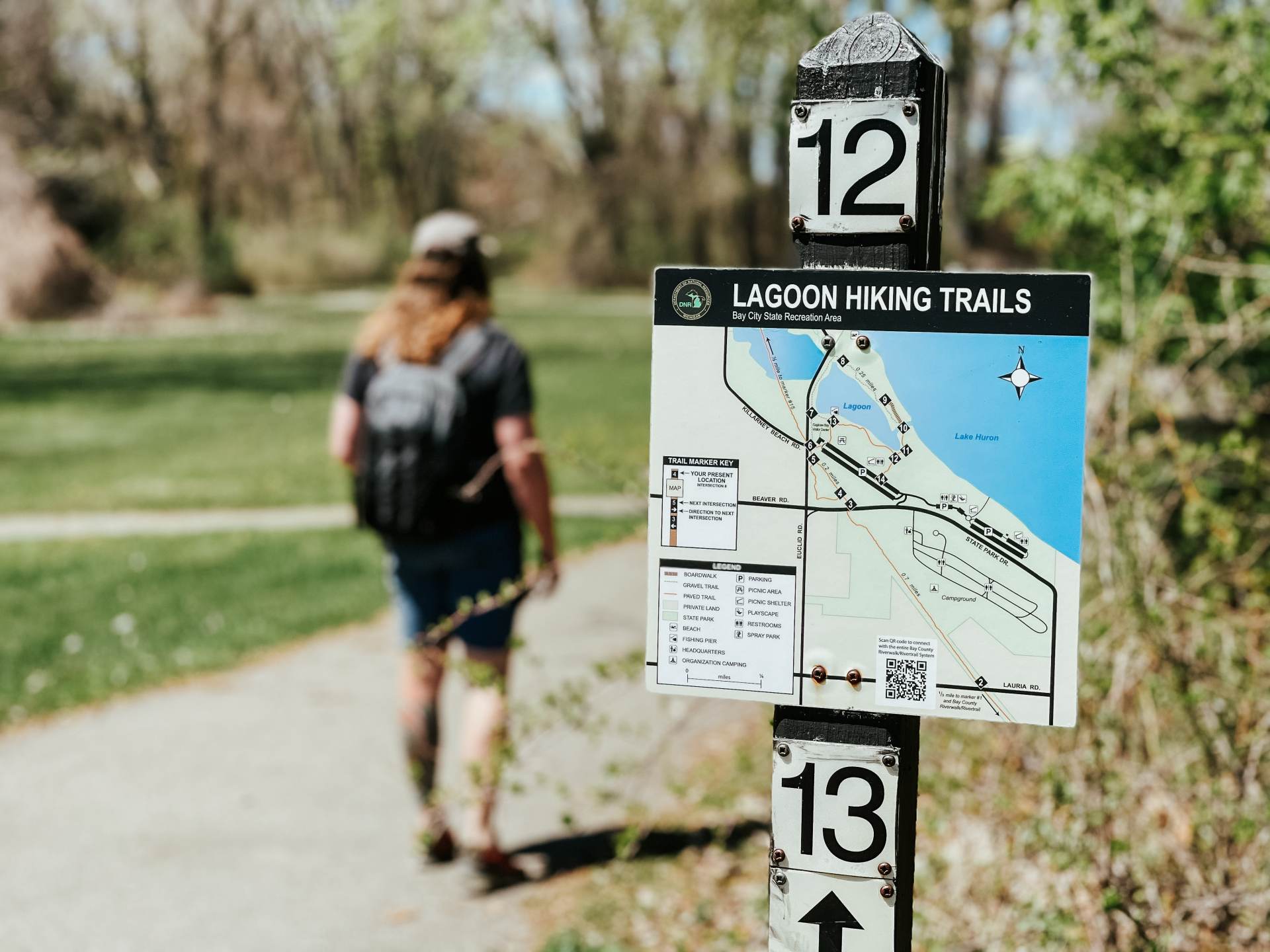 Guy walking the Lagoon Hiking Trails of Tobico Marsh at Bay City State Park in Bay City