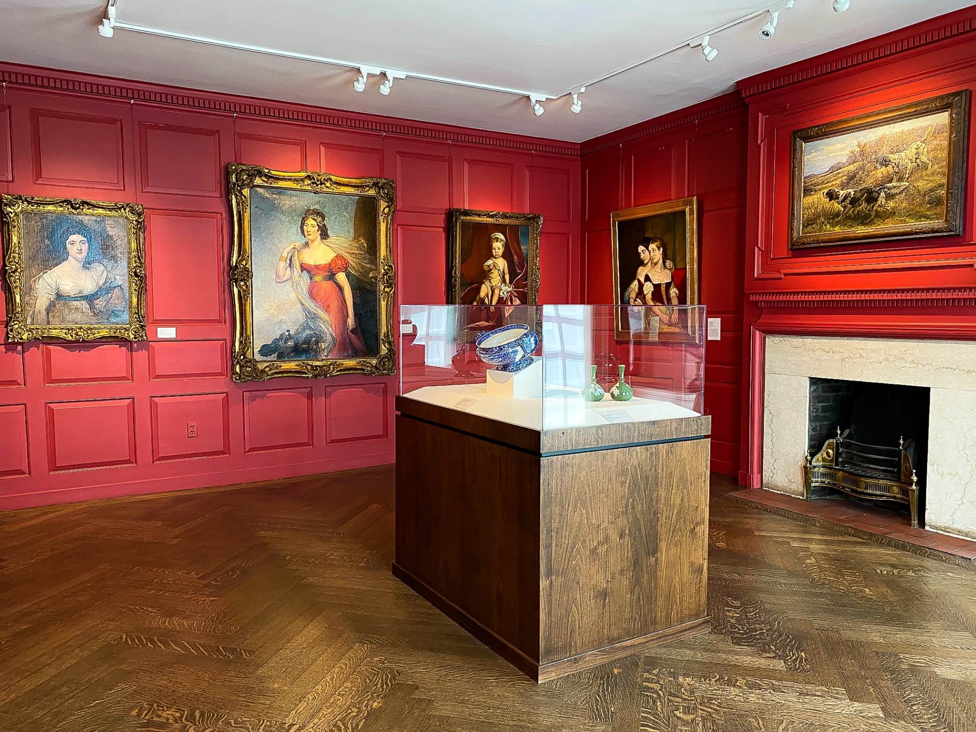 Paintings and pottery on display inside the Saginaw Art Museum in Saginaw