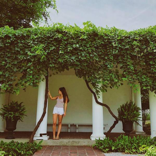 Girl looking out onto the Italianate gardens surrounding the Saginaw Art Museum