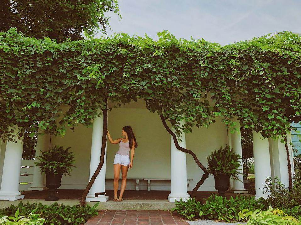 Girl looking out onto the Italianate gardens surrounding the Saginaw Art Museum