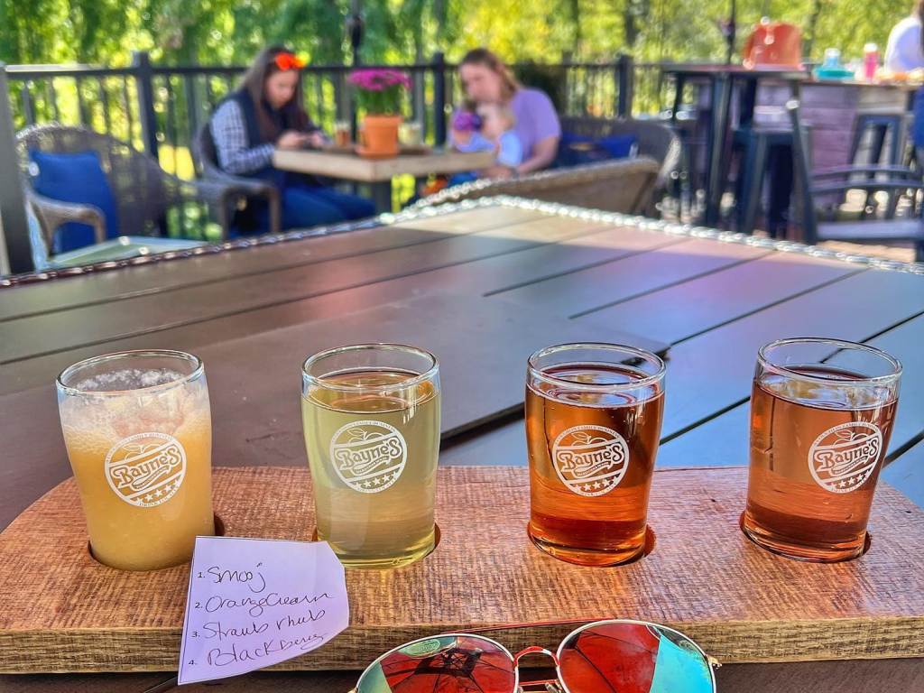 A flight of hard ciders from Bayne's Hard Cider House on the back patio of Bayne's Apple Valley Farm in Freeland on a gorgeous fall day