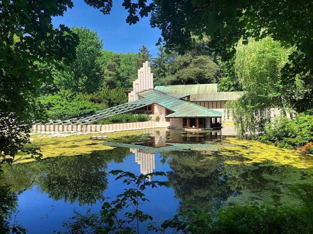 Gorgeous views of the Alden B. Dow Home & Studio in Midland, peeking through the trees from across the pond