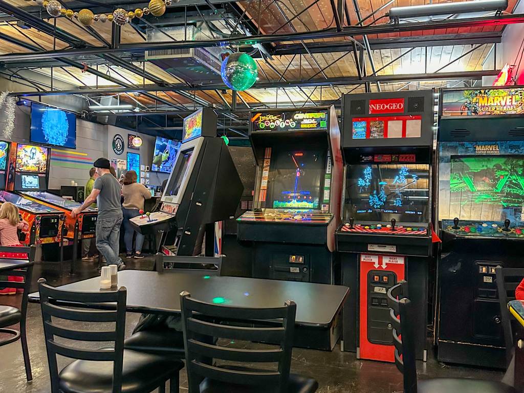 Interior views of a lineup of video arcade games inside Brinstar in Midland, Michigan