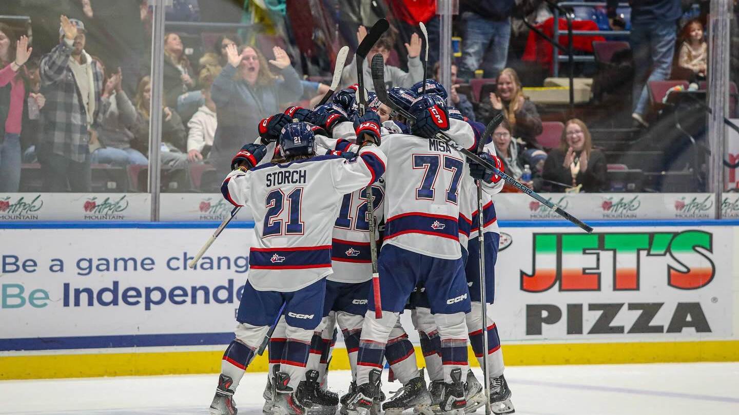 Players celebrating on the ice during a Saginaw Spirit OHL hockey game at The Dow Event Center in Saginaw, Michigan