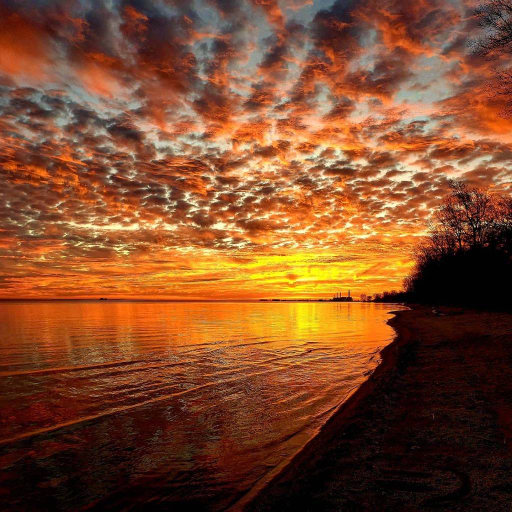 Gorgeous, colorful sunset over the water at Bay City State Park in Bay City
