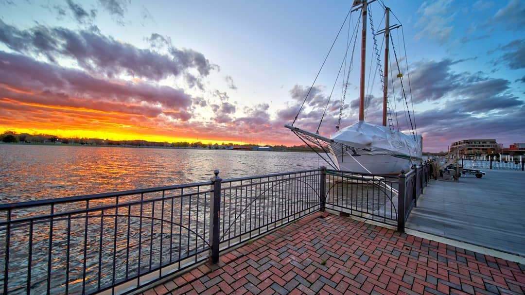 BaySail's Appledore Tall Ships docked in Bay City at sunset