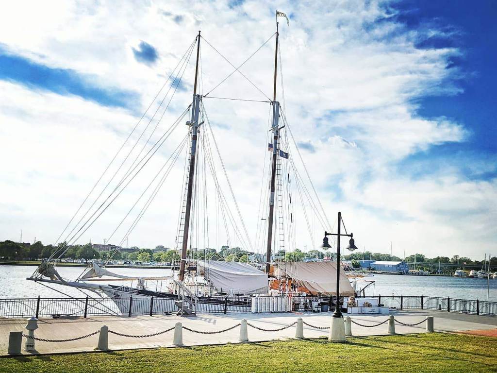 Appledore IV tall ship being uncovered for the summer season at BaySail in Bay City