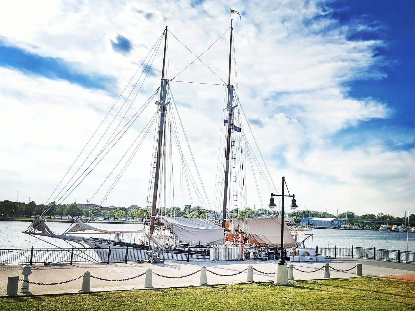 Appledore IV tall ship being uncovered for the summer season at BaySail in Bay City