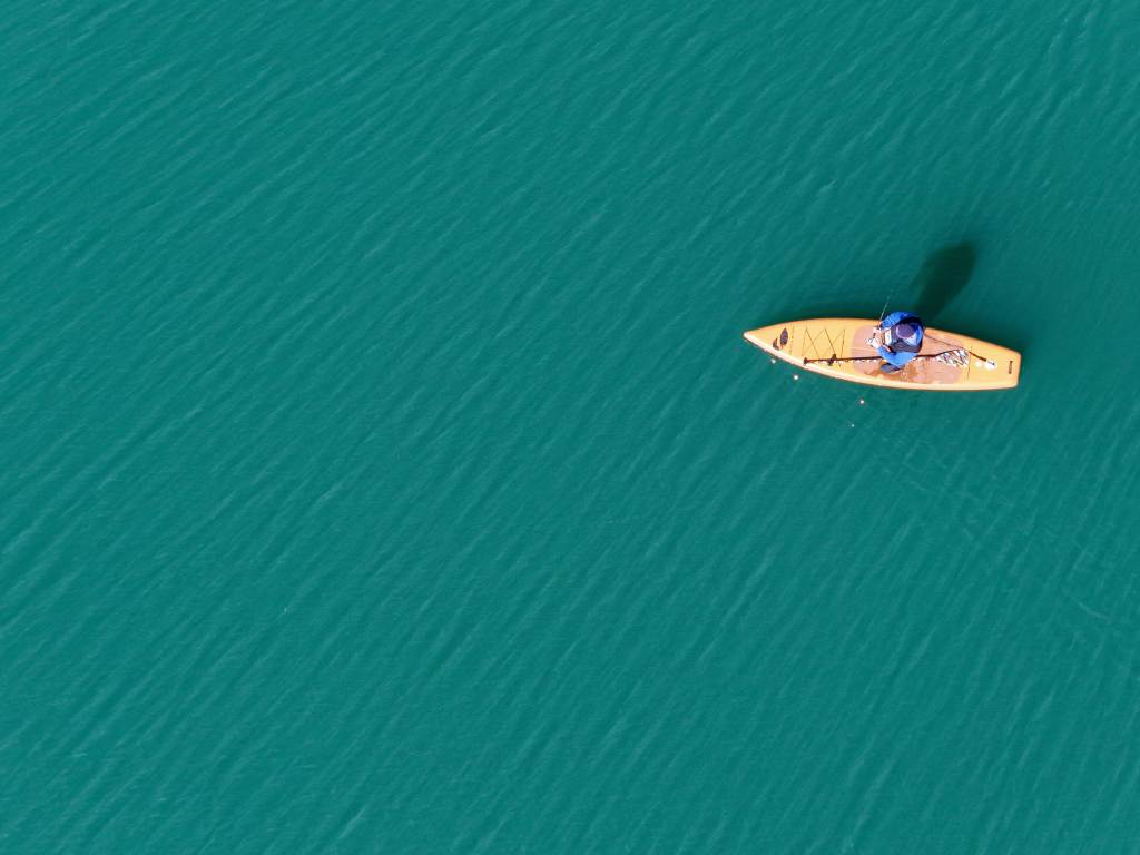 Aerial views of a paddleboarder on the peaceful, 40-acre lake at Haithco Recreation Area in Saginaw, Michigan